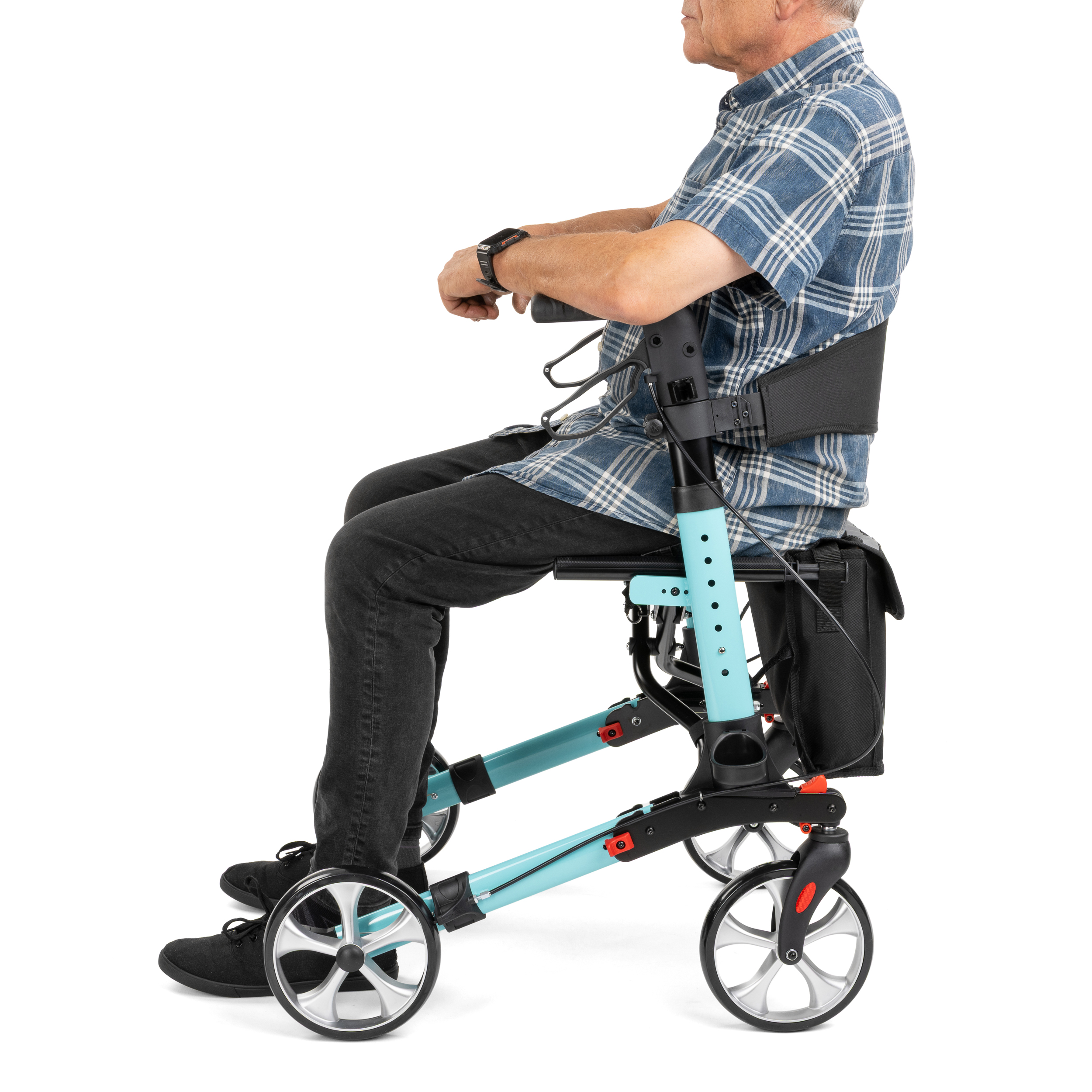rolator_yola_4 - fizio trgovina side view of an elderly man in a plaid shirt seated in a modern, teal-colored powered wheelchair with large front wheels and a control handgrip nearby.