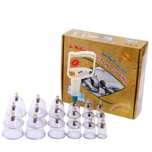 Cupping therapy kit with multiple glass cups and a hand pump beside a brown box labeled 'Action Cupping'