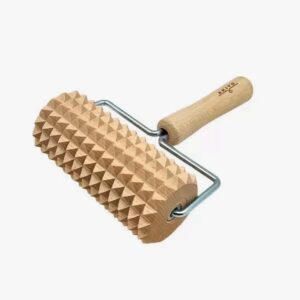 Wooden rolling pin with pyramid spikes and a metal frame, used to emboss dough.