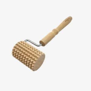 Wooden ridged rolling pin used to emboss dough patterns.