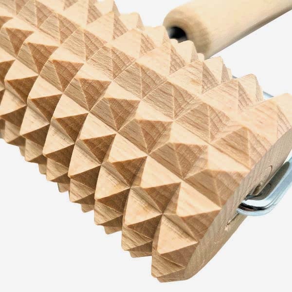 masazni_valjcek_5 - fizio trgovina wooden rolling pin with a pyramid-textured surface used to imprint patterns on dough.