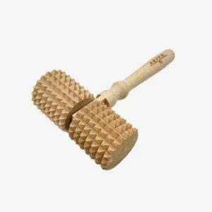 Wooden meat tenderizer with two ridged rollers attached to a handle, used to tenderize meat.